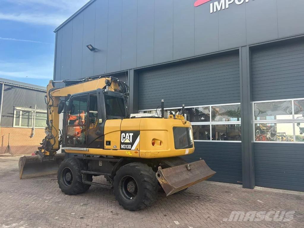 CAT M313D حفارات بعجل