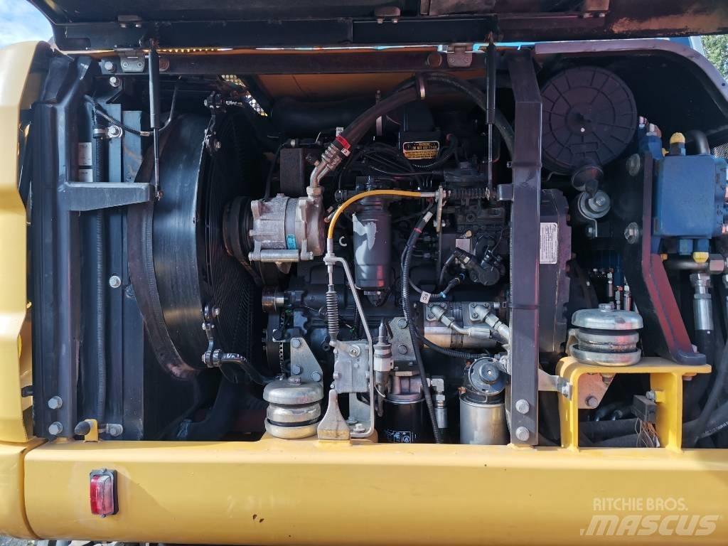 New Holland MH 2.6 حفارات بعجل