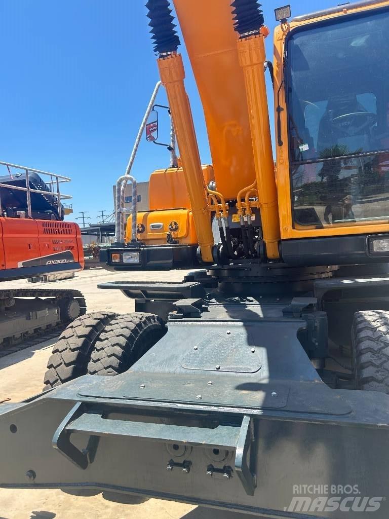 Hyundai 210w-9 حفارات بعجل