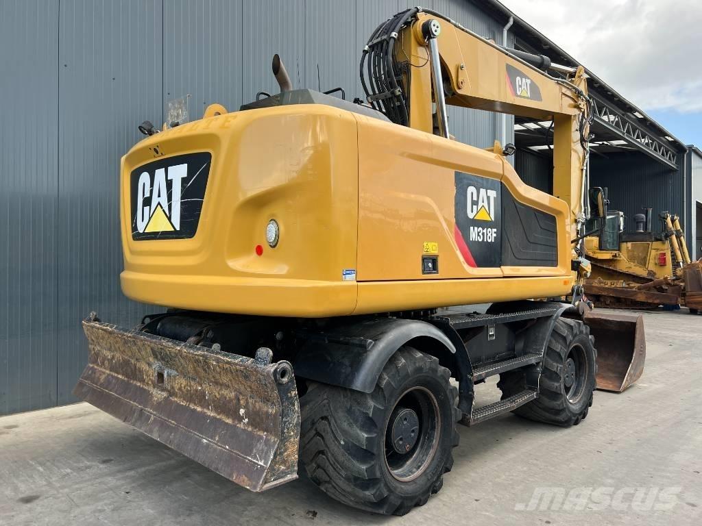 CAT M318F حفارات بعجل