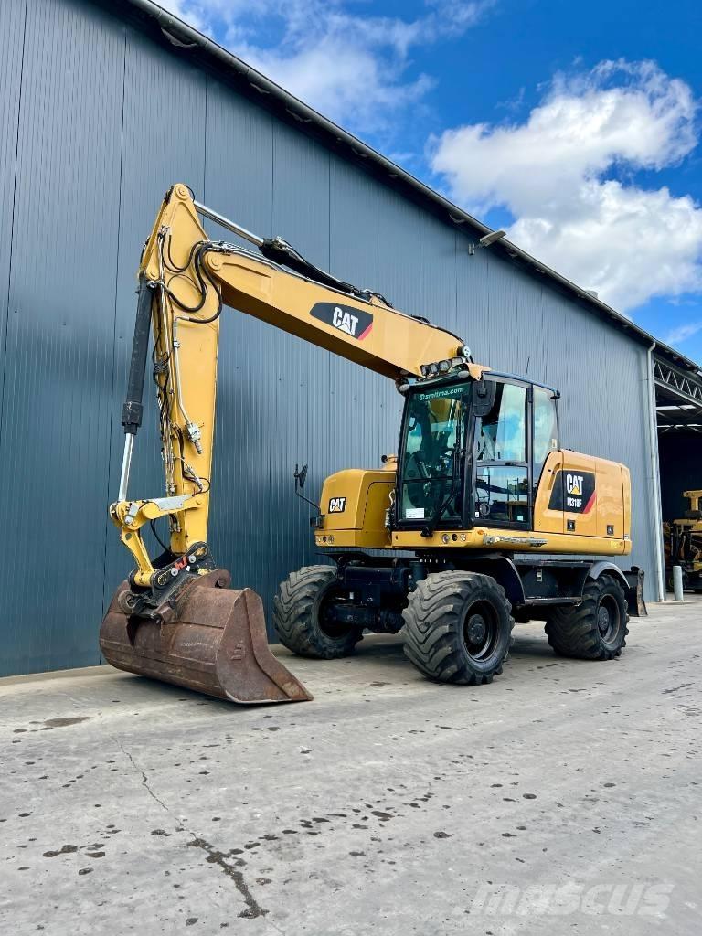 CAT M318F حفارات بعجل