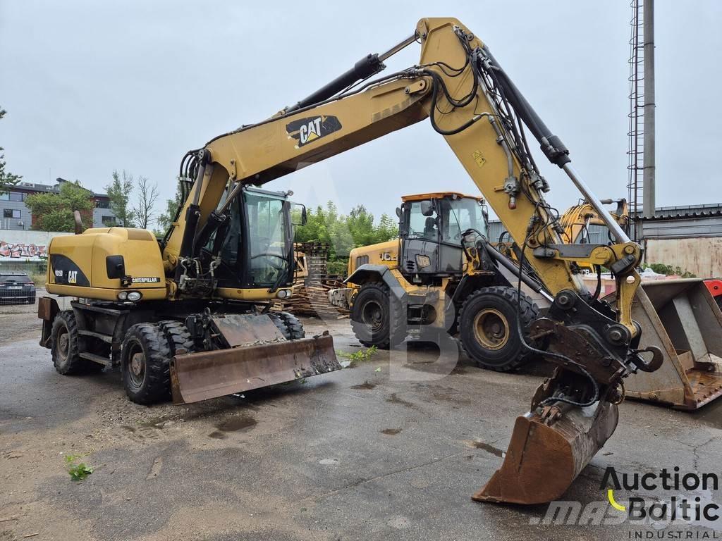 CAT M 315 D حفارات بعجل