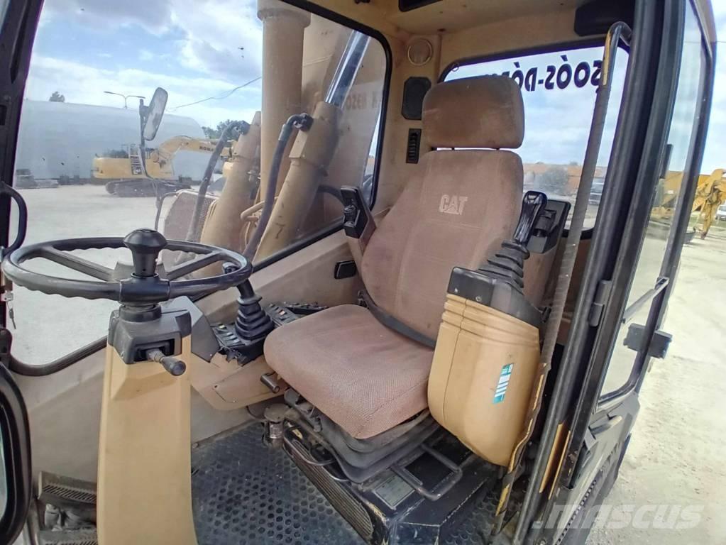 CAT M 315 حفارات بعجل
