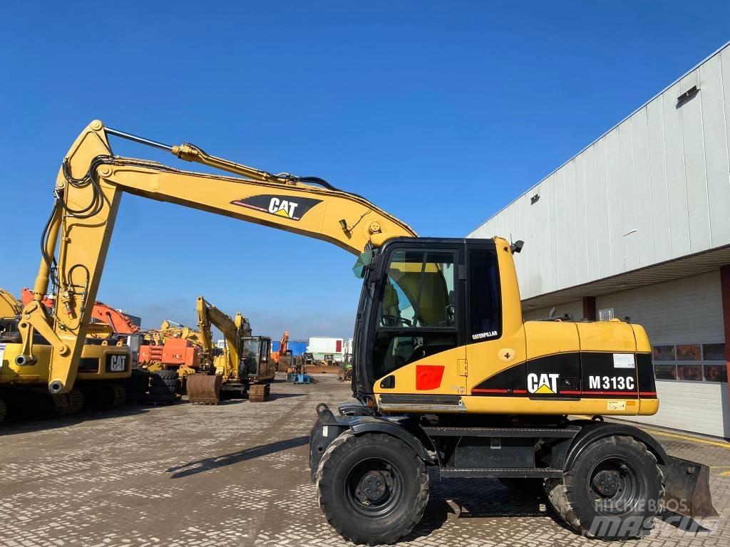 CAT M 313 C حفارات بعجل