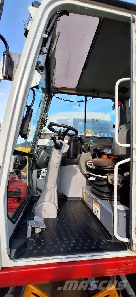 Takeuchi TB 295 W حفارات بعجل