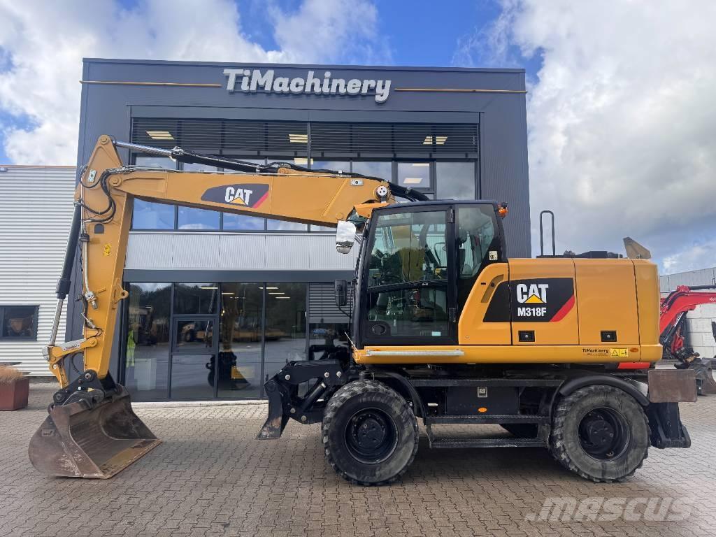 CAT M 318 F حفارات بعجل