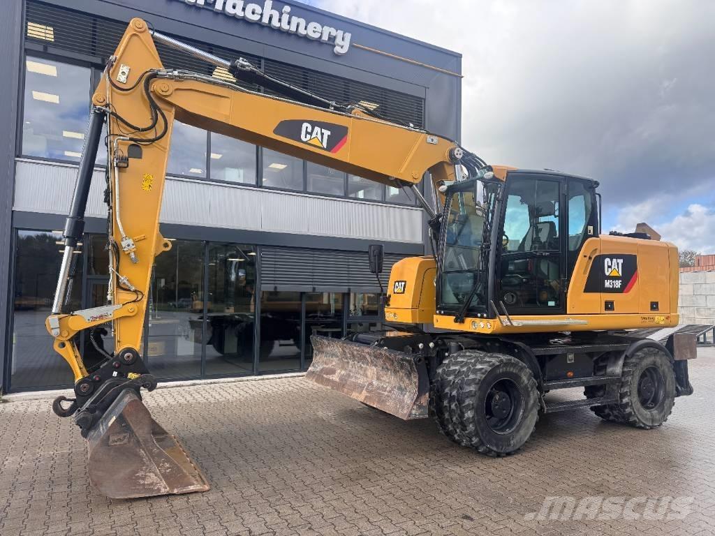 CAT M 318 F حفارات بعجل
