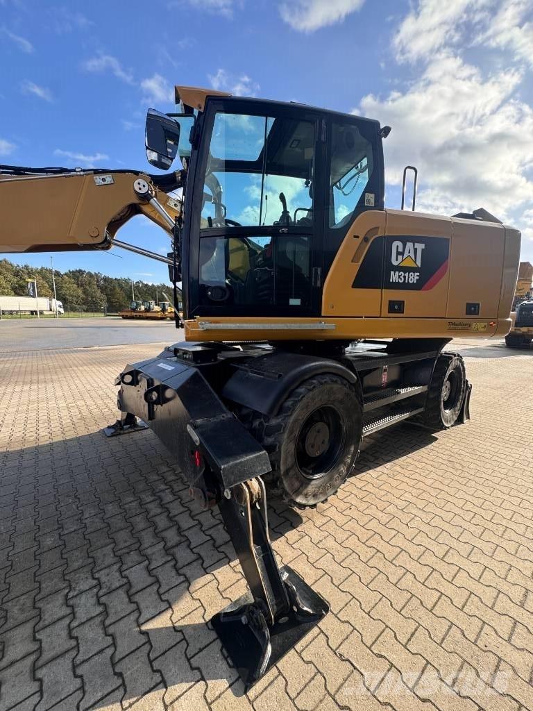 CAT M 318 F حفارات بعجل