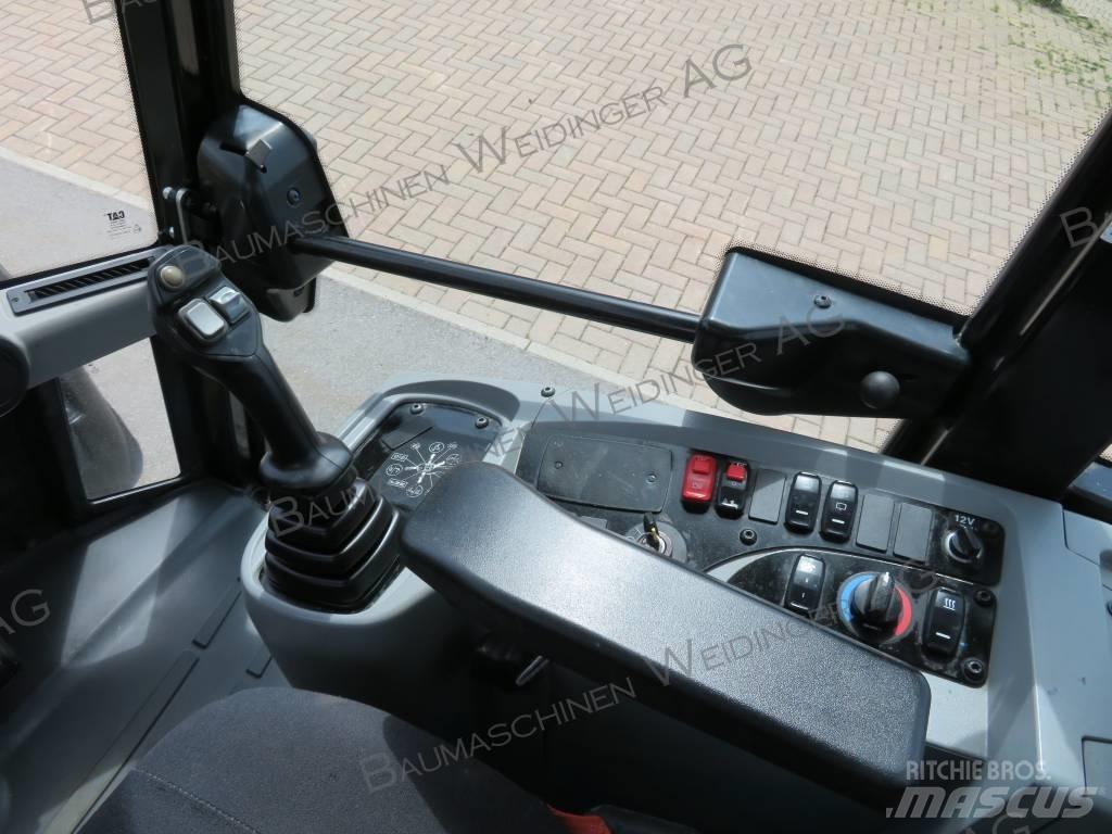 CAT 906M لوادر بعجل