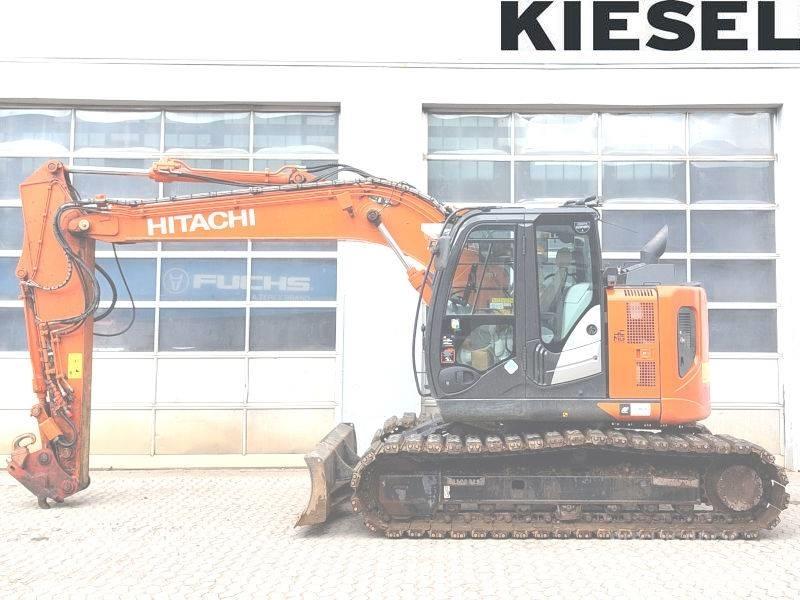 Hitachi ZX 135 US-6 حفارات زحافة