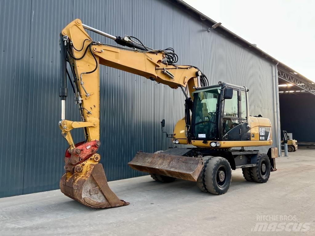 CAT M315D حفارات بعجل