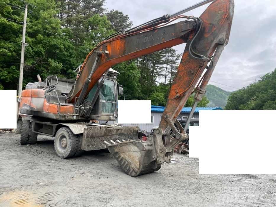 Doosan DX 210 W حفارات بعجل