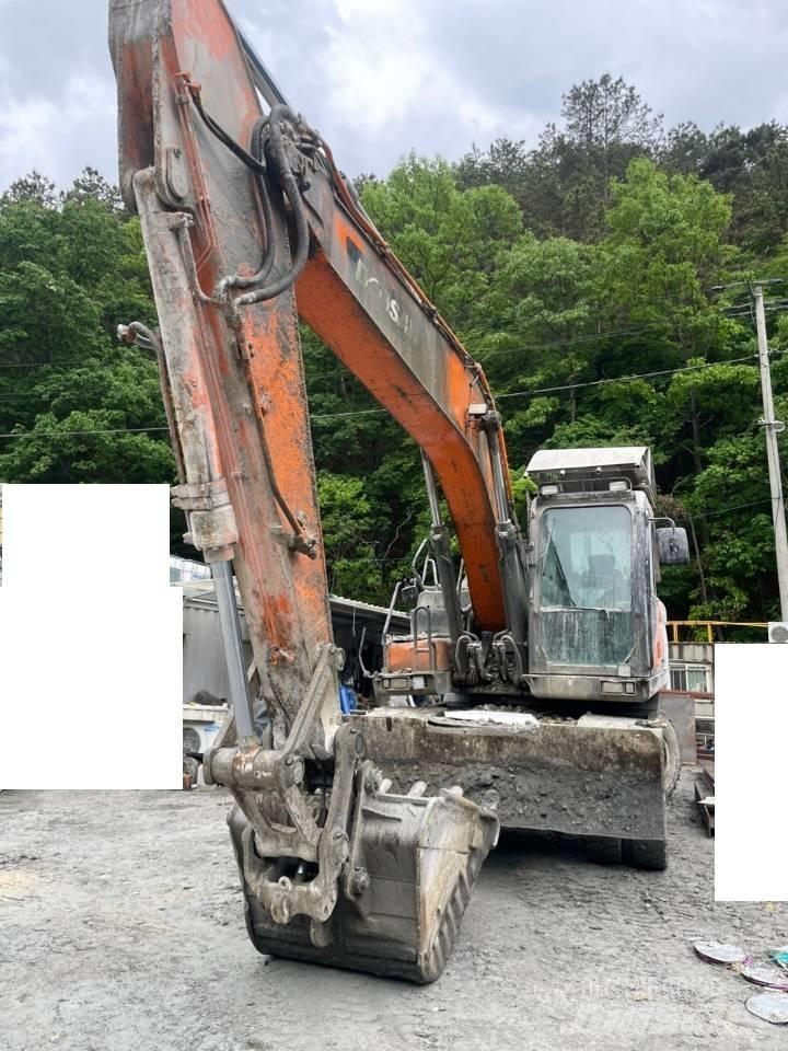 Doosan DX 210 W حفارات بعجل