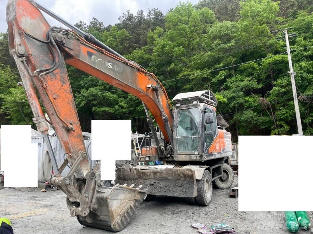 Doosan DX 210 W حفارات بعجل