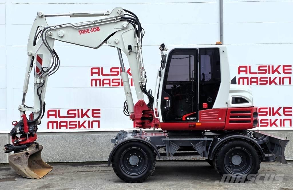 Takeuchi TB 295 W حفارات بعجل