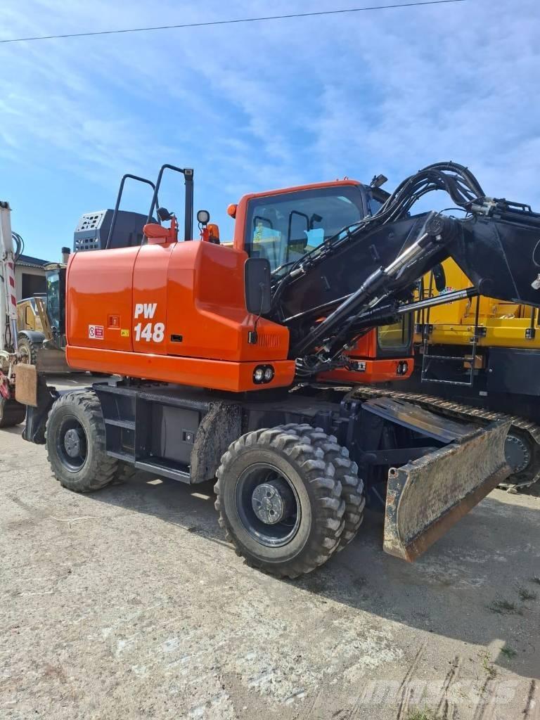 Komatsu PW 148-11 حفارات بعجل