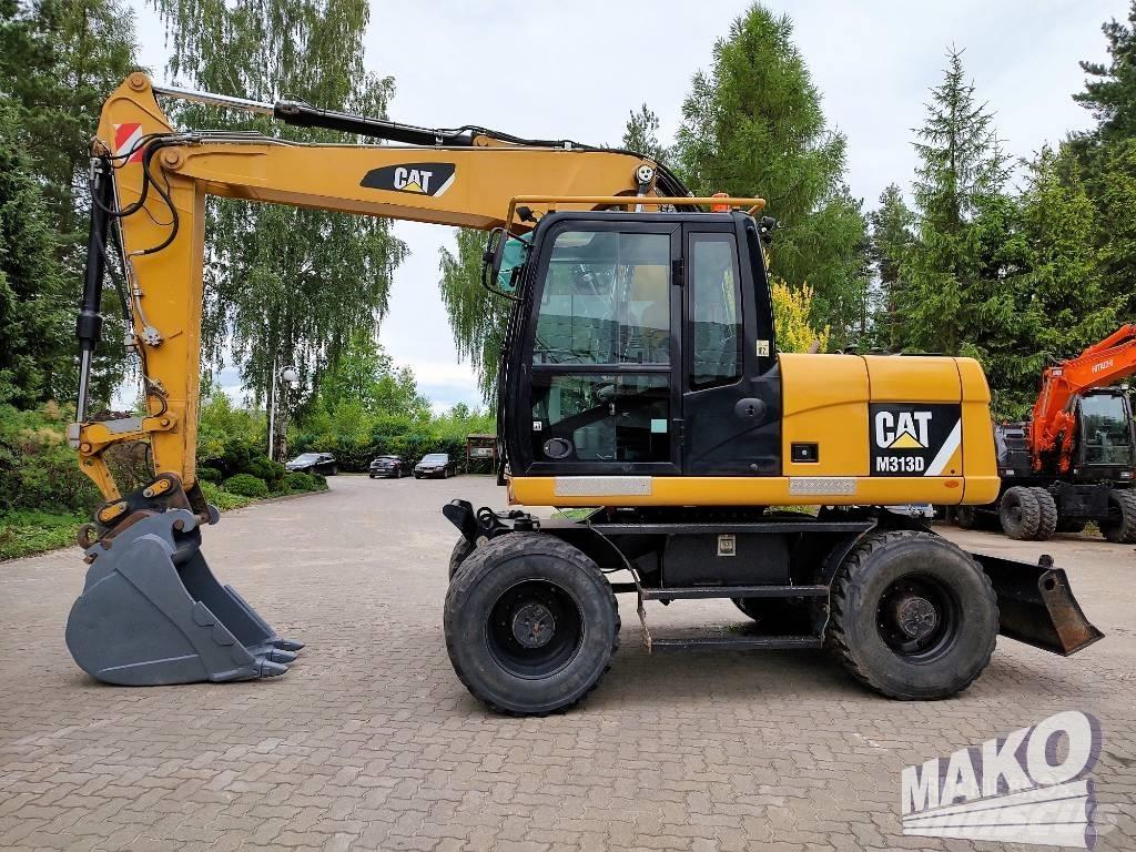 CAT M 313 D حفارات بعجل