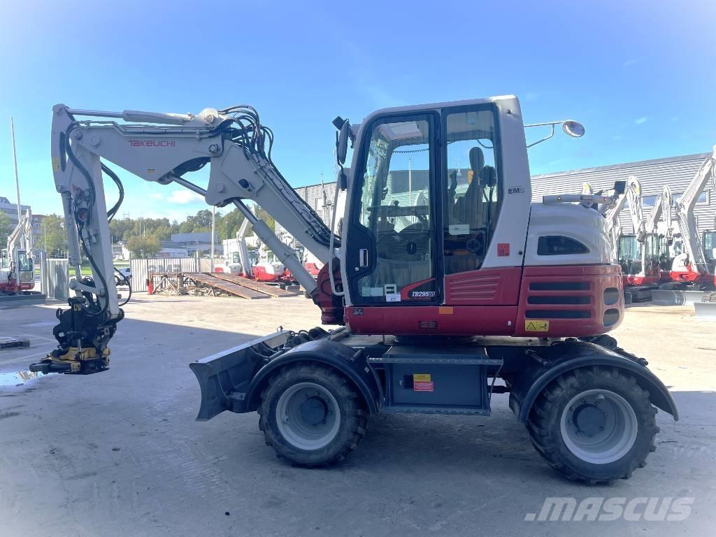 Takeuchi TB 295 W حفارات بعجل