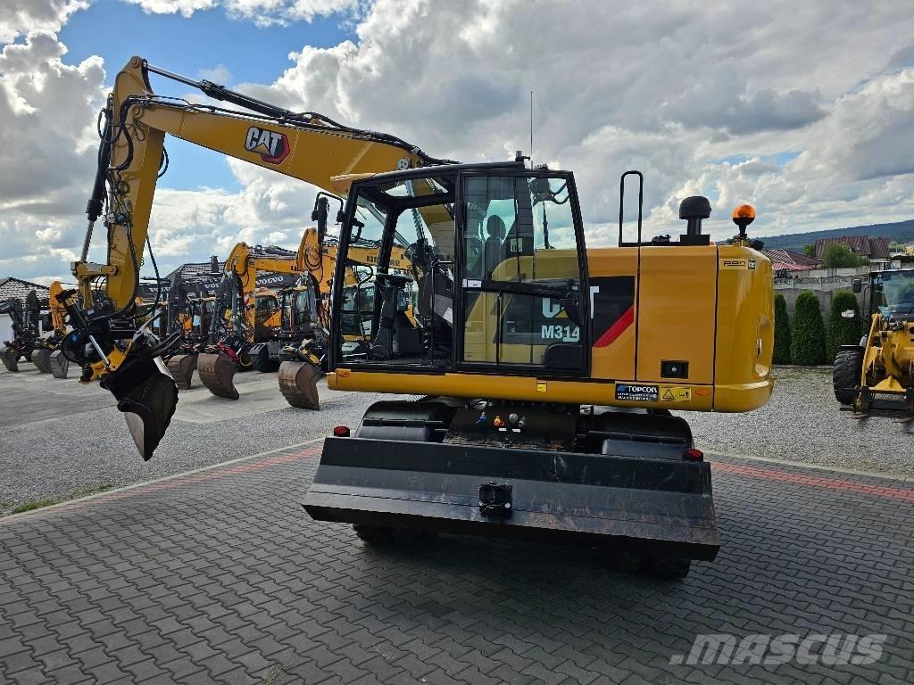 CAT M 314 F حفارات بعجل