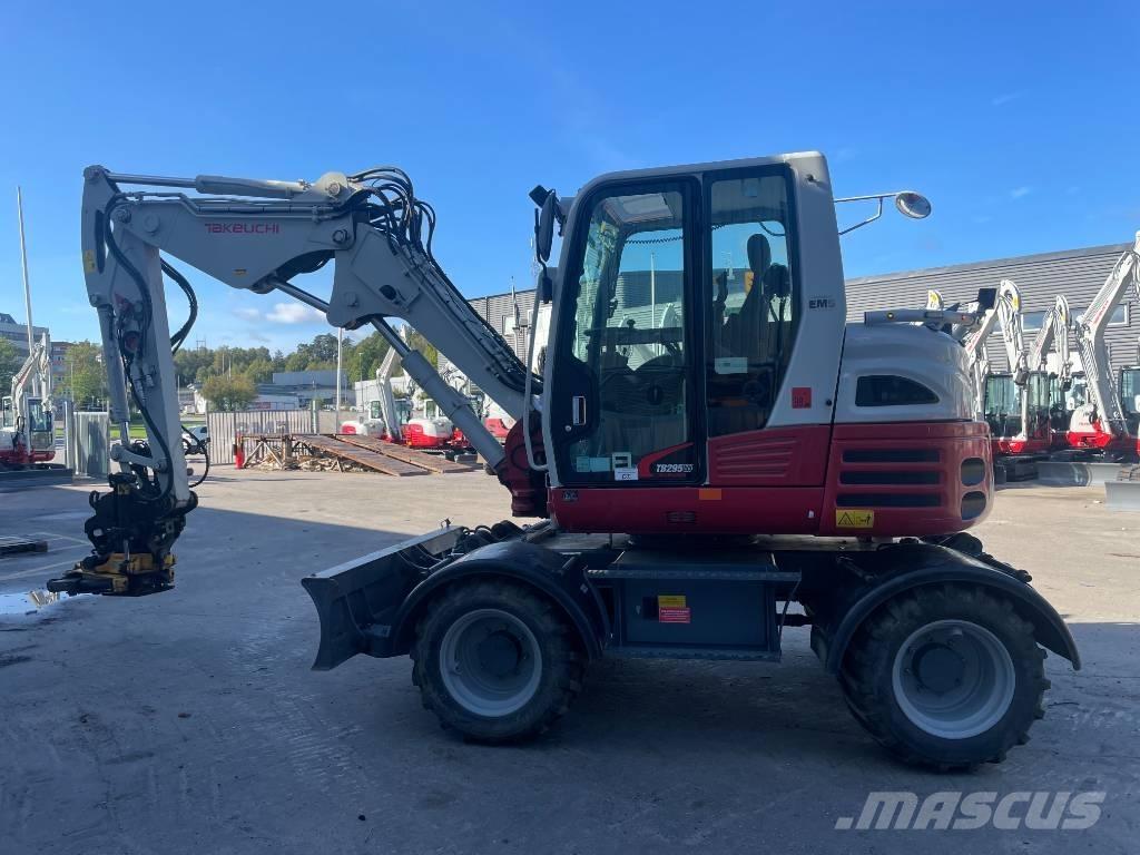 Takeuchi TB 295W حفارات بعجل