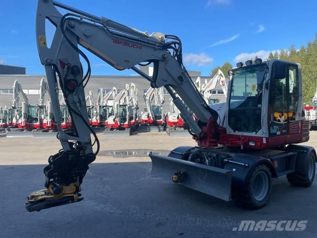 Takeuchi TB 295W حفارات بعجل