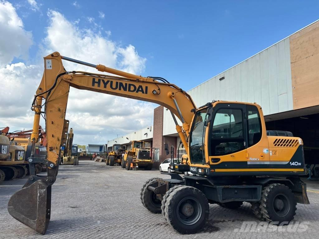 Hyundai 140W-9 حفارات بعجل