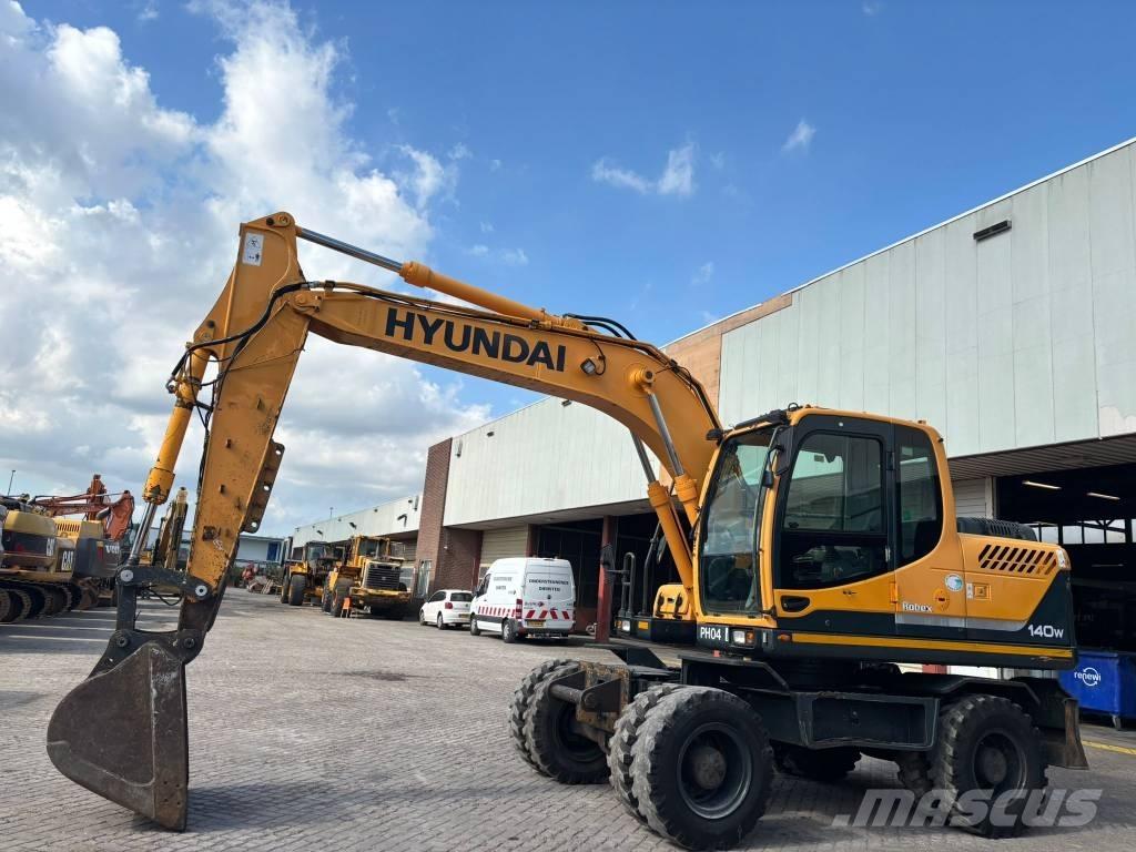 Hyundai 140W-9 حفارات بعجل