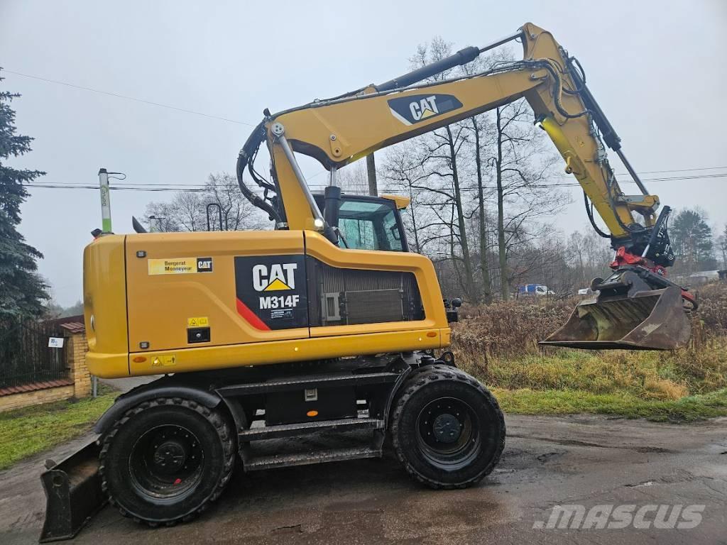 CAT m 314 F حفارات بعجل