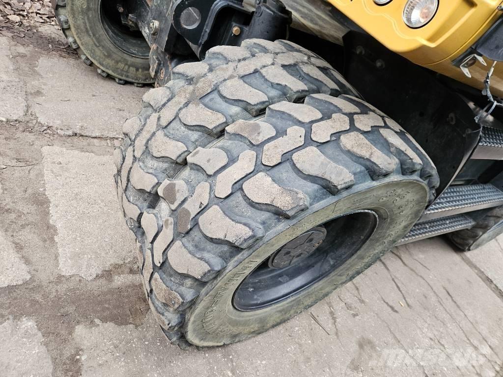 CAT m 314 F حفارات بعجل