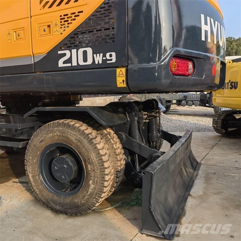 Hyundai 210W -9 حفارات بعجل