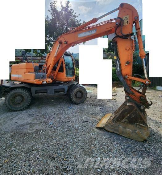 Doosan DX 140 W حفارات بعجل