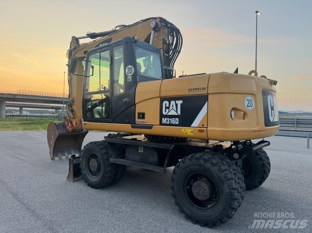 CAT M 316 D حفارات بعجل