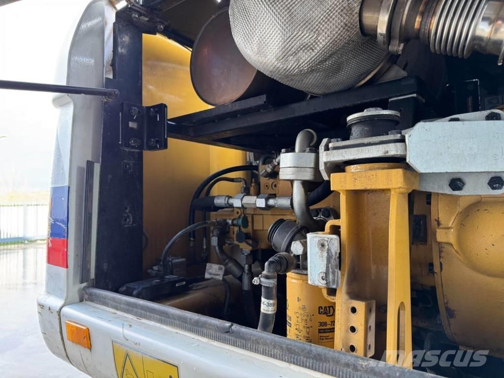 CAT M315D حفارات بعجل