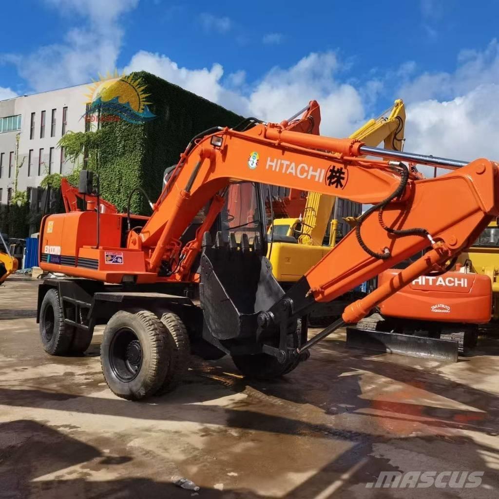 Hitachi EX 100 W D حفارات بعجل