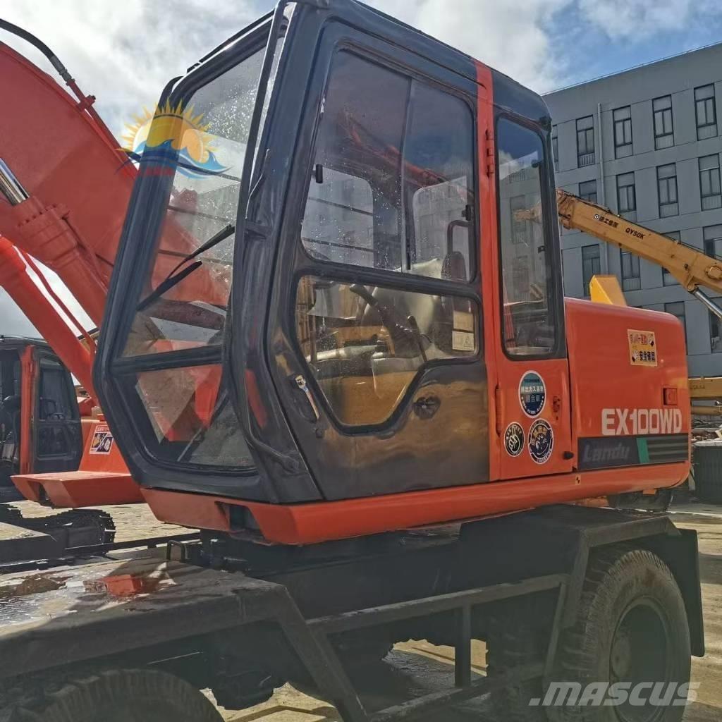 Hitachi EX 100 W D حفارات بعجل