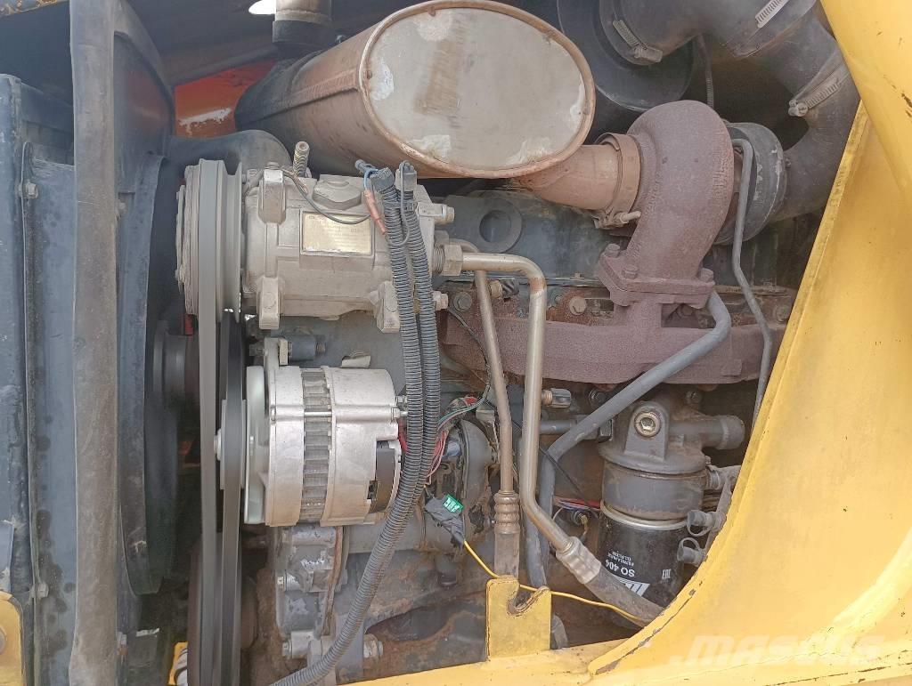 New Holland LB 110 لوادر ذات جرافات عكسية