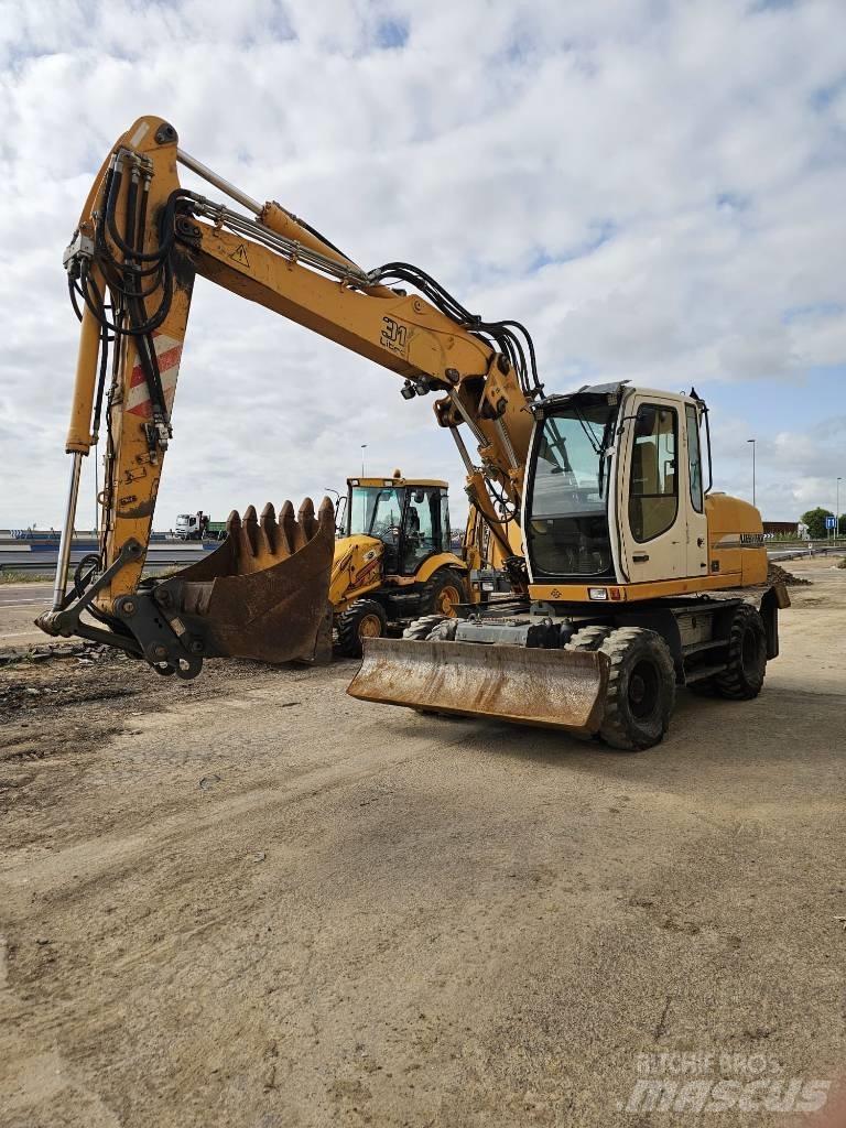 Liebherr 314 حفارات بعجل