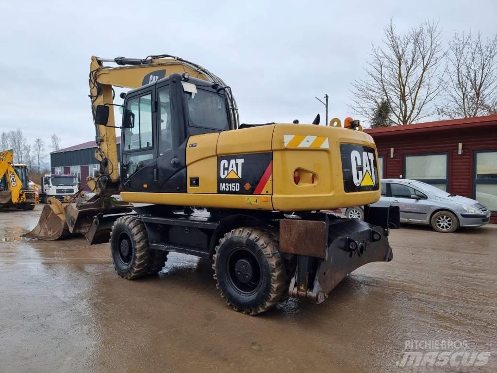 CAT M 315 D II حفارات بعجل