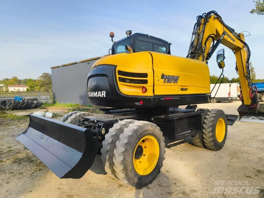 Yanmar B 110 W حفارات بعجل