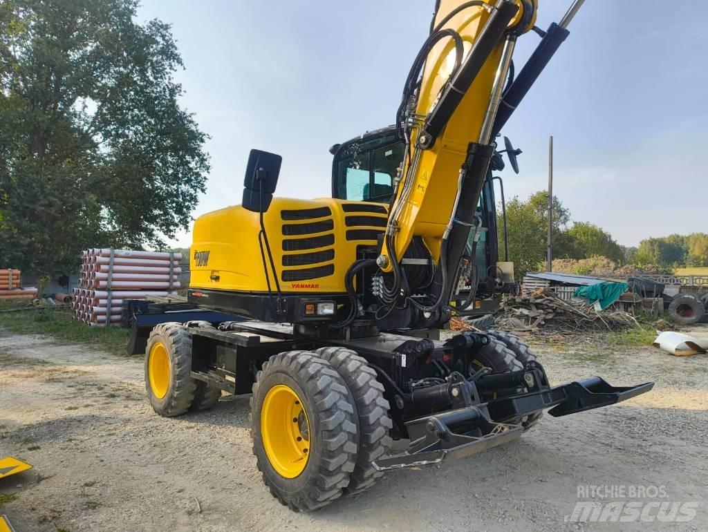Yanmar B 110 W حفارات بعجل