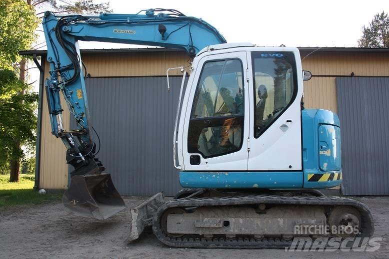  New Hollan E 70 BSR حفارات وسط 7 طن - 12 طن