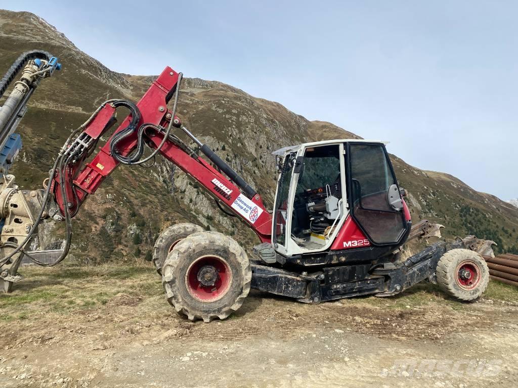 Menzi Muck 325 حفارات بعجل