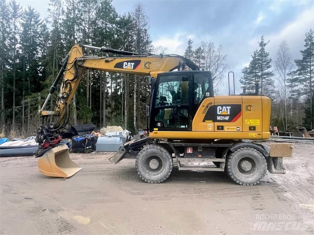 CAT M 314 F حفارات بعجل