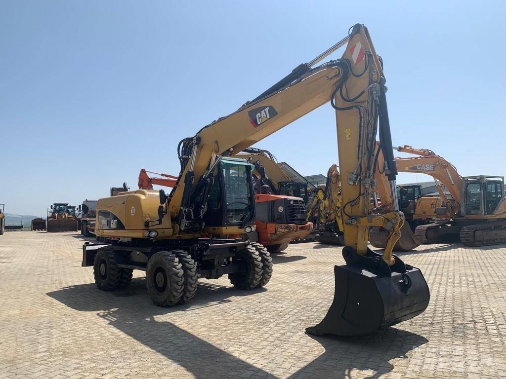 CAT M 316 D حفارات بعجل