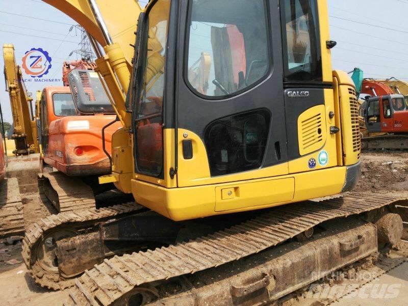 Komatsu PC 128 US حفارات وسط 7 طن - 12 طن