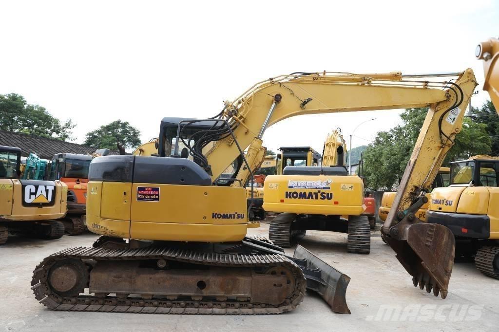 Komatsu PC 128 US حفارات وسط 7 طن - 12 طن