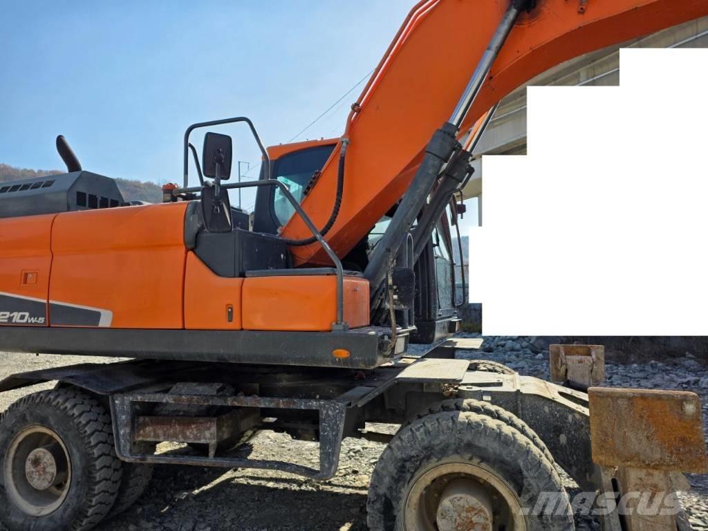 Doosan DX 210 W-5 حفارات بعجل