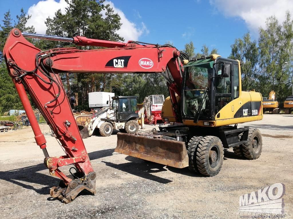 CAT M 315 C حفارات بعجل