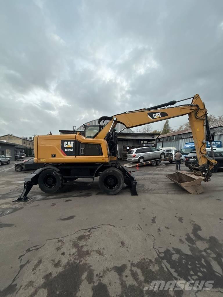 CAT M 316 F حفارات بعجل
