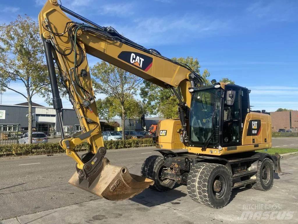 CAT M318F حفارات بعجل